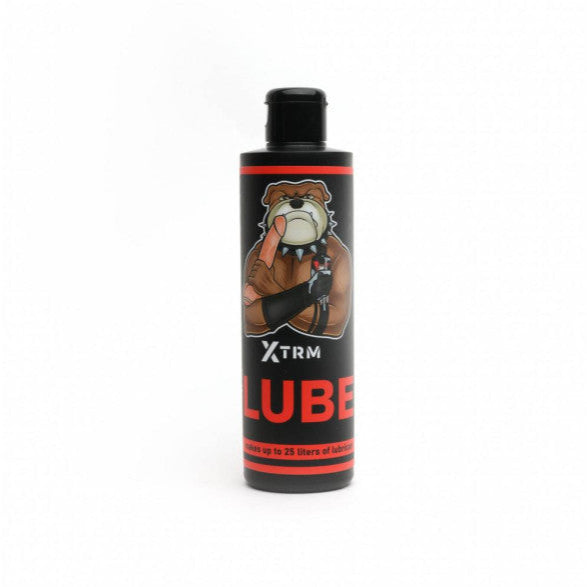 Bottle of XTRM LUBE with a bear graphic on a white background