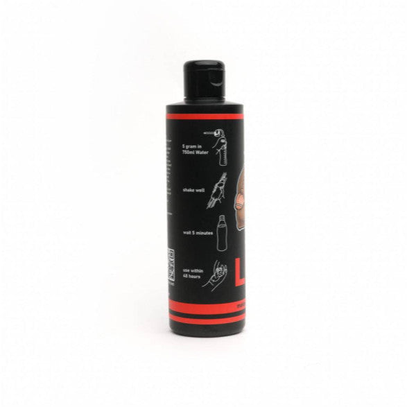 Black and red bottle with label on a white background