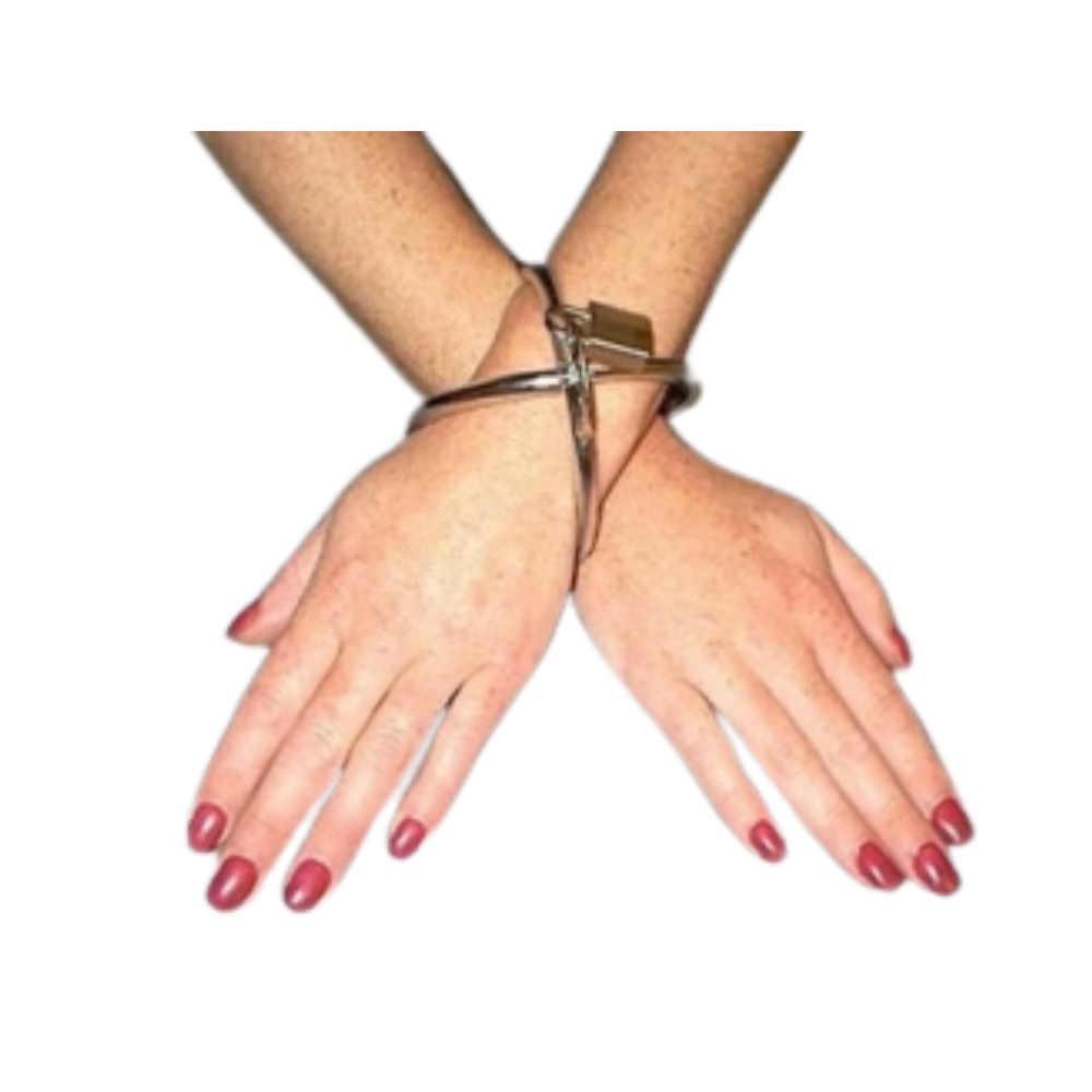 chrome restraint on a person's wrist with a white background