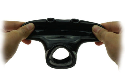 Black nutt sack held between two hands against a white background