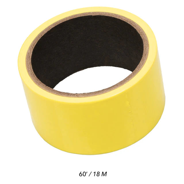 Yellow tape roll on a white background