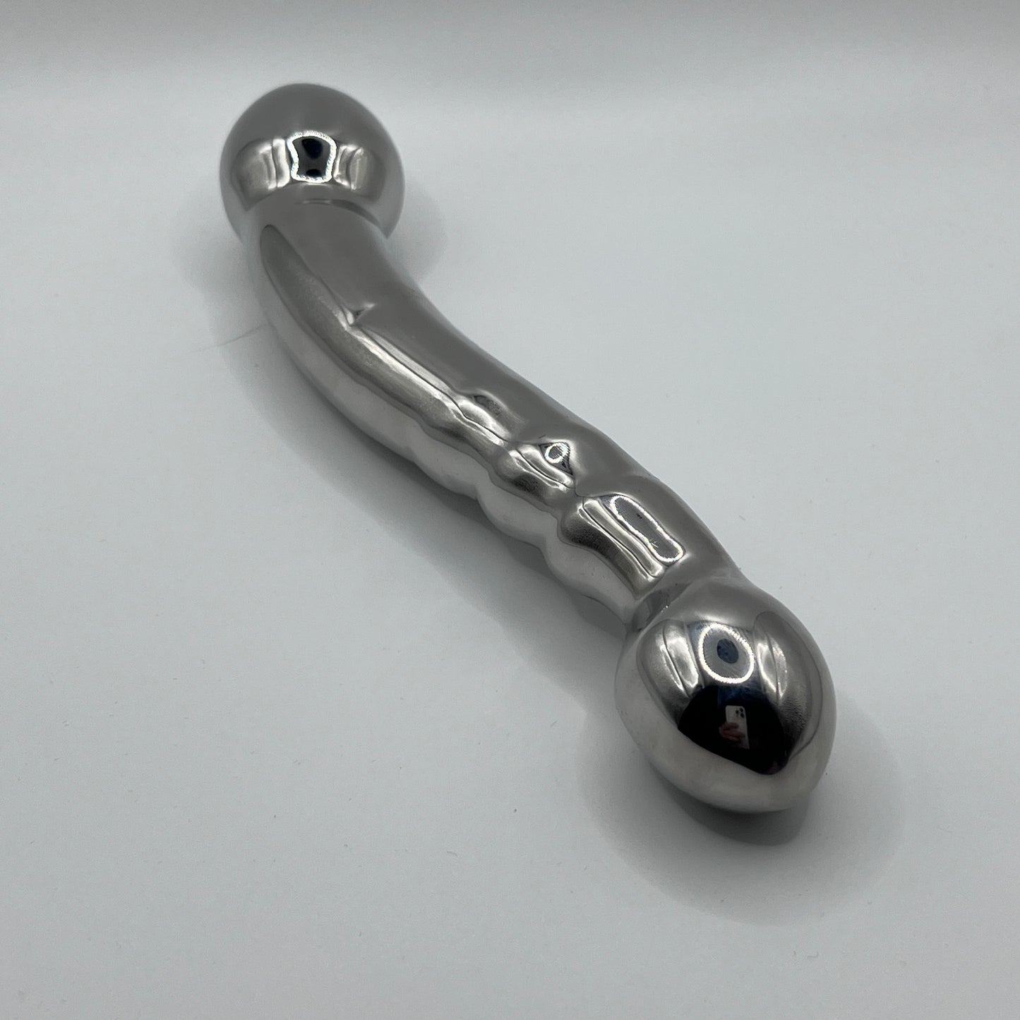 Metallic handle on a light gray background