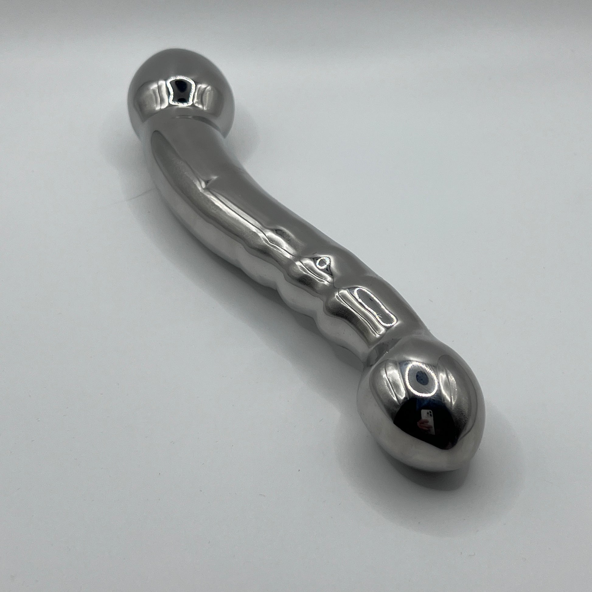 Metallic handle on a light gray background