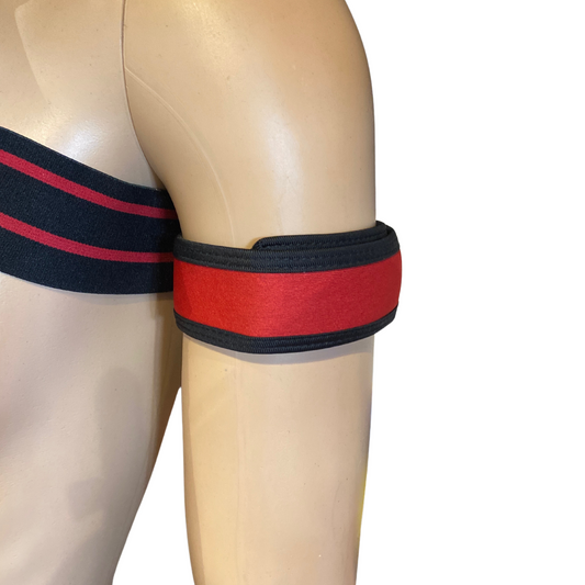 Red and black band on a mannequin arm against a white background