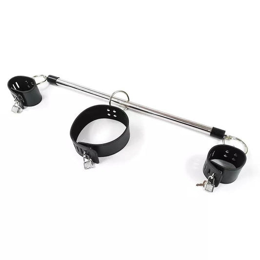 A metal and black restraint set featuring a long silver bar, a black collar, and two black cuffs with small silver padlocks and keys, photographed on a plain white background.