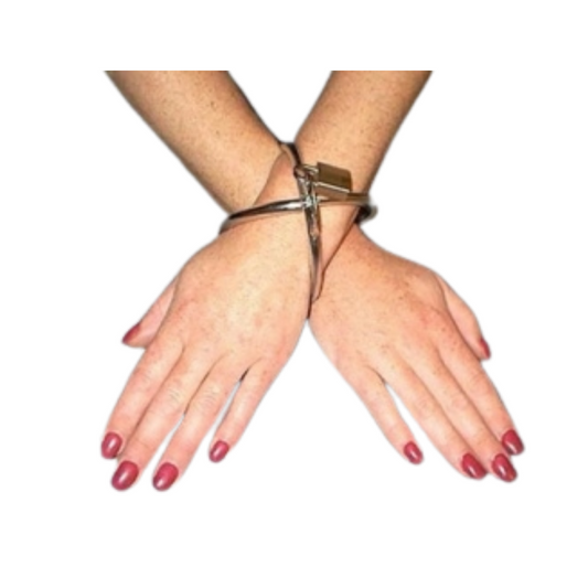 chrome restraint on a person's wrist with a white background