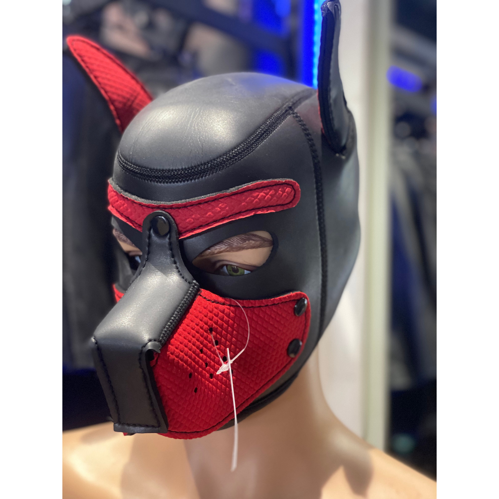 Black and red mask with dog-like features on a mannequin head.