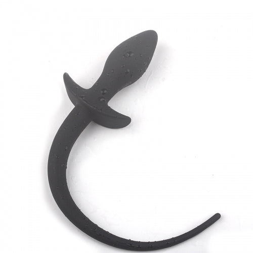 A matte black curved silicone insert with a tapered tip and a curved base, shown on a plain white background with water droplets on its surface.